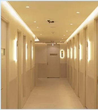 Corridor lined with private single recovery rooms