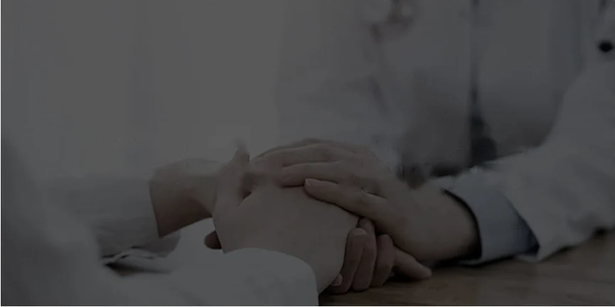 U&U medical staff holding a patient's hand