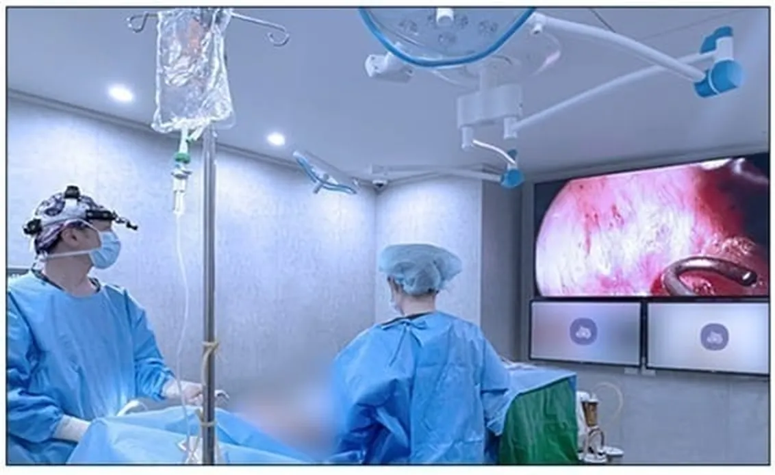 U&U operating room during surgery, viewing the 70-inch FULL HD endoscope monitor